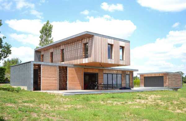 Réalisation d'une maison individuelle contemporaine avec bois et béton dans un esprit Loft par un architecte à Lille.